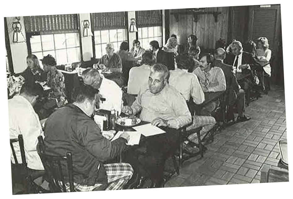 Image of the interior of a Mr. D's Seafood and Hamburgers location, showing multiple tables and booths filled with people eating a meal.